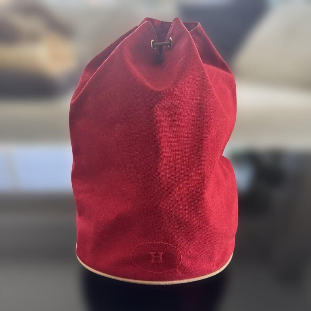 エルメス赤いキャンバスドローストリングショルダーバック