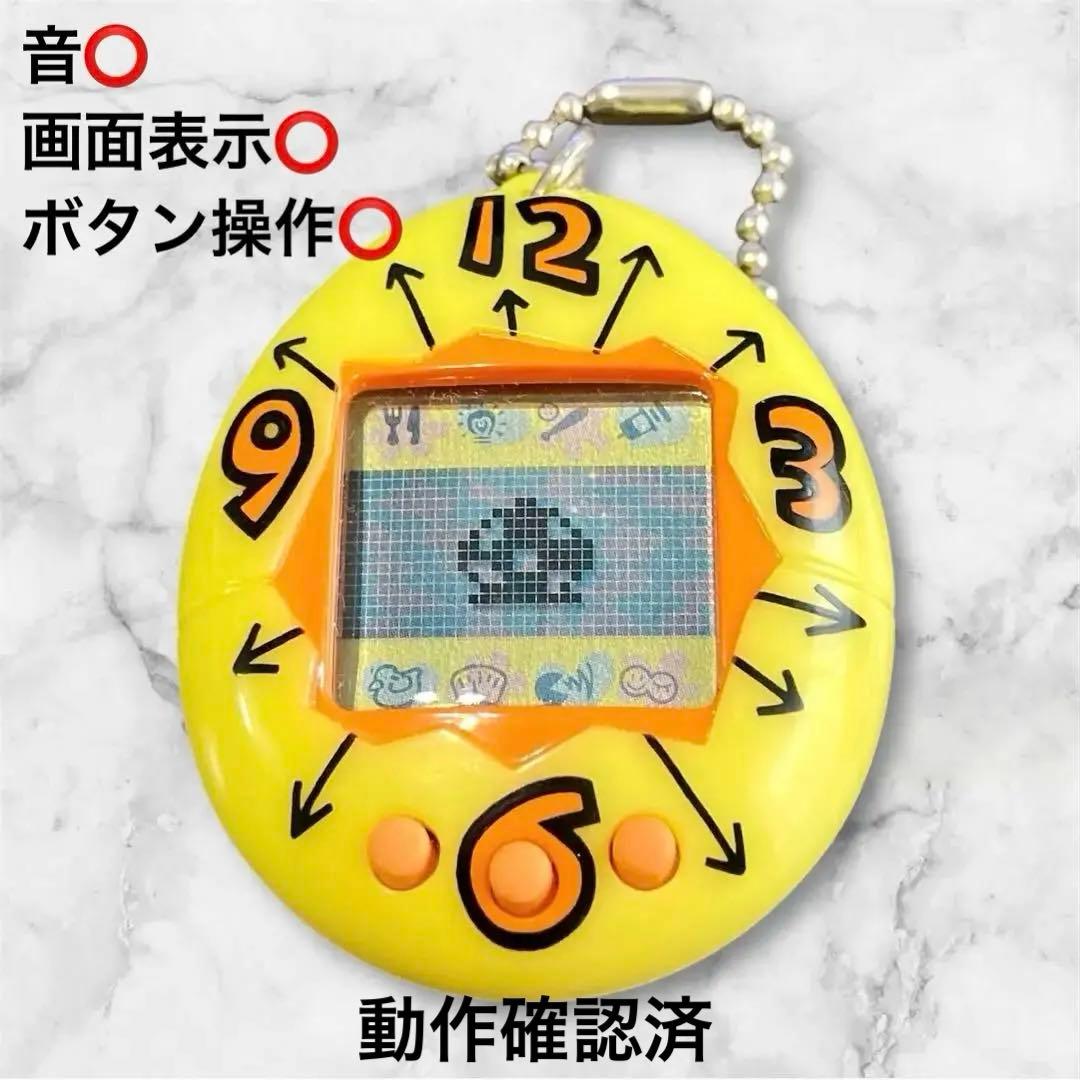 BANDAI 初代 たまごっち 海外版 時計柄イエロー 【動作確認済】 - メルカリ