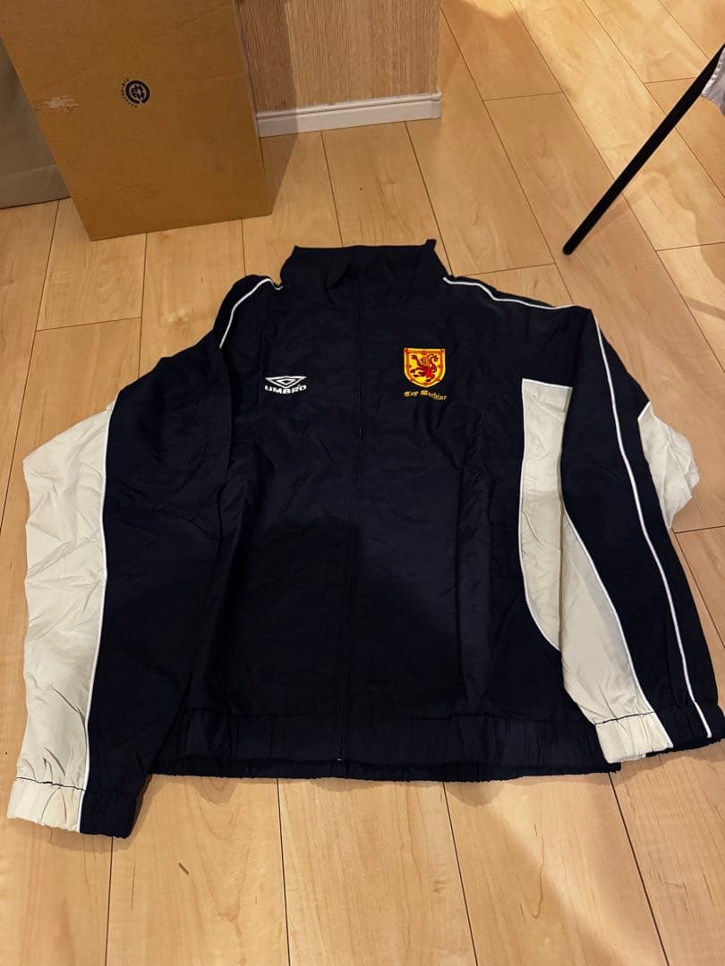 アンブロ トイマシーンコラボ ナイロンジャケット L - メルカリ