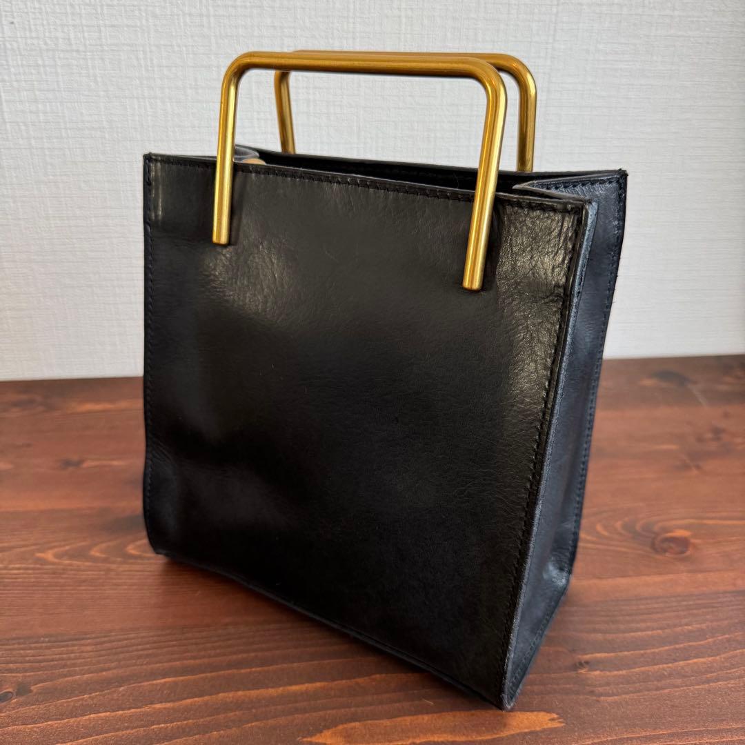 Emma Aura ゴールドハンドルバッグ 黒 - メルカリ