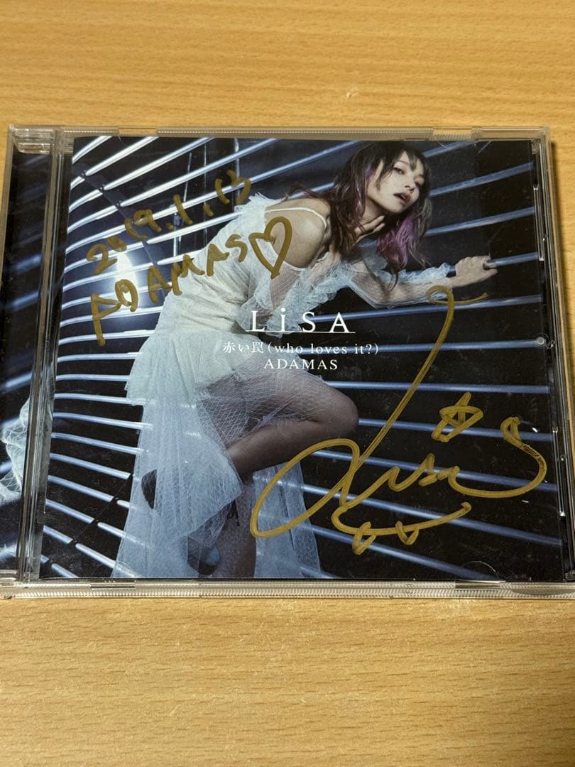 LiSA ADAMAS 赤い罠 直筆サイン入りCD LiSA 赤い罠(who loves it ?)/ADAMAS 直筆サイン - メルカリ