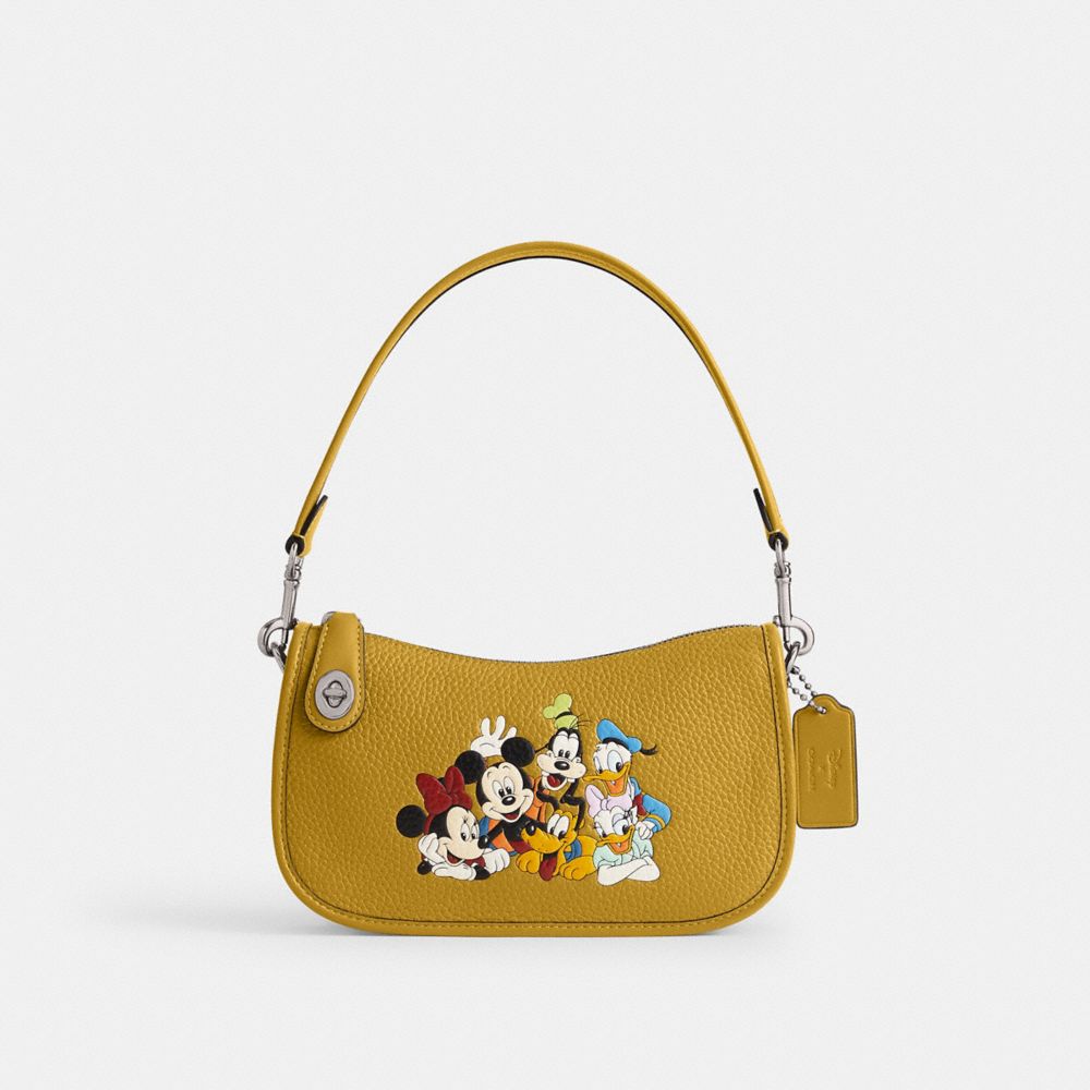 COACH® | Disney X Coach Swinger Bag In Regenerative Leather With
